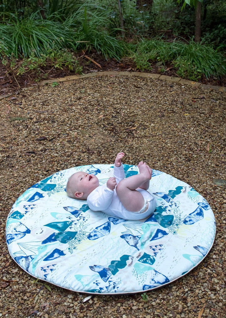 Baby playing on a Blue Mountains Activity Play Mat - Marmalade Lion